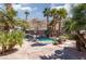 Beautiful pool area with palm trees and mountain backdrop at 440 Probst, Las Vegas, NV 89110