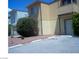 Tan building with balconies, landscaping, and parking at 4820 W Twain Ave, Las Vegas, NV 89103