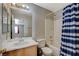 Bathroom with tub, shower, and striped curtain at 501 Riata Way, Las Vegas, NV 89110