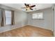 Spacious bedroom with ceiling fan and laminate wood flooring at 501 Riata Way, Las Vegas, NV 89110