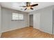 Bedroom with ceiling fan, laminate flooring and sliding door closet at 501 Riata Way, Las Vegas, NV 89110