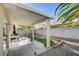 Covered patio with artificial turf, a grill, and space for outdoor furniture at 501 Riata Way, Las Vegas, NV 89110