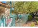 View of a community swimming pool with fence at 5415 W Harmon Ave # 2056, Las Vegas, NV 89103