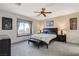 Spacious bedroom with large window and ceiling fan at 542 Eagle Perch Pl, Henderson, NV 89012