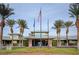 Community center with lush landscaping and flagpoles at 542 Eagle Perch Pl, Henderson, NV 89012