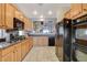 Kitchen with oak cabinets, granite countertops, and a breakfast nook at 542 Eagle Perch Pl, Henderson, NV 89012