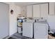 Laundry area with washer, dryer, and storage cabinets at 5457 Escondido St, Las Vegas, NV 89119