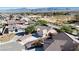 Wide aerial view of house, neighborhood and mountain range at 5480 Lincolnwood Ct, Pahrump, NV 89061