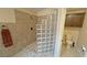 Bathroom with shower, toilet and glass block feature at 5480 Lincolnwood Ct, Pahrump, NV 89061