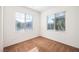 Well-lit bedroom featuring two windows with blinds at 628 Taliput Palm Pl, Henderson, NV 89011