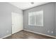 Simple bedroom with double door closet and wood-look flooring at 649 Taliput Palm Pl, Henderson, NV 89011