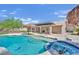 Stunning pool and spa with a waterfall feature at 7831 Rancho Destino Rd, Las Vegas, NV 89123