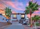 Two story house with attached garage at dusk at 9316 Perennial Ave, Las Vegas, NV 89148