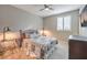 Bedroom with a ceiling fan and window shutters at 9994 Chaparral Wind Ave, Las Vegas, NV 89166