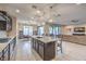 Open kitchen with large island, stainless steel appliances, and ample counter space at 9994 Chaparral Wind Ave, Las Vegas, NV 89166