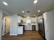 Modern kitchen with white cabinets, stainless steel appliances, and wood-look floors at , Las Vegas, NV 89147