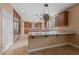 Kitchen with island, stainless steel appliances, and granite counters at 12253 Bluebird Canyon Pl, Las Vegas, NV 89138