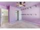 Lavender bedroom with ceiling fan and closet at 153 Sitka Spruce St, Henderson, NV 89015