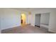 Bedroom with carpet, mirrored closet, and private bathroom at 1842 N Decatur Blvd # 203, Las Vegas, NV 89108