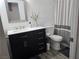 Clean bathroom with dark vanity, white countertop, and shower at 2615 W Gary Ave # 2090, Las Vegas, NV 89123