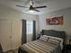 Spacious bedroom with a comfortable bed and gray bedding at 2615 W Gary Ave # 2090, Las Vegas, NV 89123