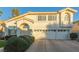 Two-story house with a three-car garage and manicured landscaping at 2673 Mallard Landing Ave, Henderson, NV 89074