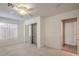 Bright bedroom with mirrored closet doors and ceiling fan at 2894 Matese Dr, Henderson, NV 89052