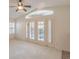 Bright living room with vaulted ceiling, plantation shutters, and access to backyard at 2894 Matese Dr, Henderson, NV 89052