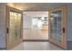 French doors opening to a view of the kitchen and living area at 336 Merit Ct, Henderson, NV 89014