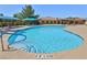 Relaxing freeform pool with plenty of lounge chairs at 5528 Eleganza Ave, Pahrump, NV 89061