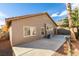 Backyard view of home, showing patio and landscaping at 10604 Royal Willow Pl, Las Vegas, NV 89144