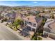 Two-story house with attached garage and landscaping at 10965 Inverlochy Ct, Las Vegas, NV 89141