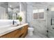 Modern bathroom with marble tile and floating vanity at 10965 Inverlochy Ct, Las Vegas, NV 89141