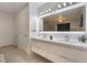 Double vanity bathroom with modern design and sleek countertops at 1168 Spago Ln, Henderson, NV 89052