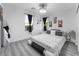 Spacious bedroom with large bed, gray walls, and modern decor at 1168 Spago Ln, Henderson, NV 89052