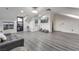 Bonus room features gray flooring, modern decor, and access to a private balcony at 1168 Spago Ln, Henderson, NV 89052