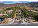 Luxury community entrance with gated access, fountains, and lush landscaping at 1788 Amarone Way, Henderson, NV 89012