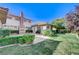 Large backyard with grassy area and stone patio at 1788 Amarone Way, Henderson, NV 89012