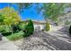 Two-car garage with gated entry and manicured landscaping at 1788 Amarone Way, Henderson, NV 89012