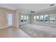 Bright living room with large windows and neutral carpeting at 1788 Amarone Way, Henderson, NV 89012