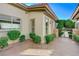 Landscaped side yard with gated access and stone pathway at 1788 Amarone Way, Henderson, NV 89012