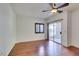 Bedroom with hardwood floors, sliding door and ceiling fan at 2110 Los Feliz St # 1097, Las Vegas, NV 89156