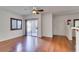 Living room with hardwood floors, sliding door and ceiling fan at 2110 Los Feliz St # 1097, Las Vegas, NV 89156