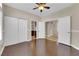 Empty bedroom featuring tile flooring, white closet doors, and access to another room at 257 El Camino Verde St, Henderson, NV 89074