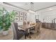 Elegant dining room with modern chandelier and hardwood floors at 2776 Laguna Seca Ave, Henderson, NV 89052