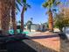 Landscaped backyard with brick path leading to pool at 3212 Gaucho Dr, Las Vegas, NV 89169