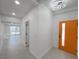 Bright entryway with an orange door and tile flooring, leading into the home at 3212 Gaucho Dr, Las Vegas, NV 89169