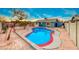 Inviting backyard oasis featuring a sparkling kidney-shaped pool at 402 Bell Ave, Henderson, NV 89015