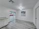 Modern dining room with grey laminate flooring and access to the backyard at 402 Bell Ave, Henderson, NV 89015