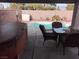 Covered patio with hot tub, seating area, and view of the pool at 410 E Gamebird Rd, Pahrump, NV 89048